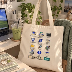 May include: A cream-coloured canvas tote bag featuring a grid of retro computer desktop icons and labels including My Computer, Recycle Bin, Windows Explorer, Setup, Network Neighborhood, Internet Explorer, Find, Help, Inbox, Outlook Express, Paint, and Run.