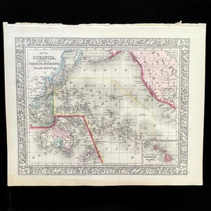 May include: Antique map of Oceanica, featuring various divisions and island groups. The map is framed with a decorative border and includes geographical details with text labels. The map is printed on aged paper.