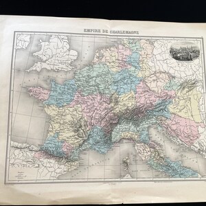 May include: Antique map of Europe, featuring the Empire of Charlemagne, with detailed geographical features and historical boundaries. The map is colored in pastel hues, with text in the upper center. The map is on aged paper.