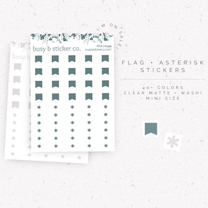 May include: Sheets of stickers featuring flag and asterisk designs in teal. The stickers are labeled as "Flag + Asterisk Stickers" with the text "40+ Colors, Clear Matte, Washi, Mini Size". The brand name "busy b sticker co." is also visible.
