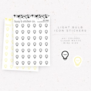 May include: Two sheets of mini light bulb icon stickers, one with black icons and one with yellow icons. The text reads busy b sticker co., 180 | black, busybstickerco.com, LIGHT BULB ICON STICKERS, 40+ COLORS, CLEAR MATTE, and MINI SIZE.
