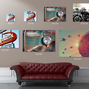May include: A collection of vintage-inspired wall art prints featuring a rusty truck, a Route 66 motel sign, a motorcycle, and a Ferris wheel. The prints are in various sizes, ranging from 5x7 inches to 30x40 inches.