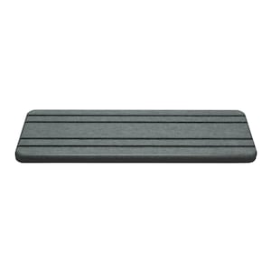 May include: A rectangular, gray doormat with a textured surface and horizontal black stripes. The mat has rounded corners and is designed for placement at an entryway. The color is a muted gray.