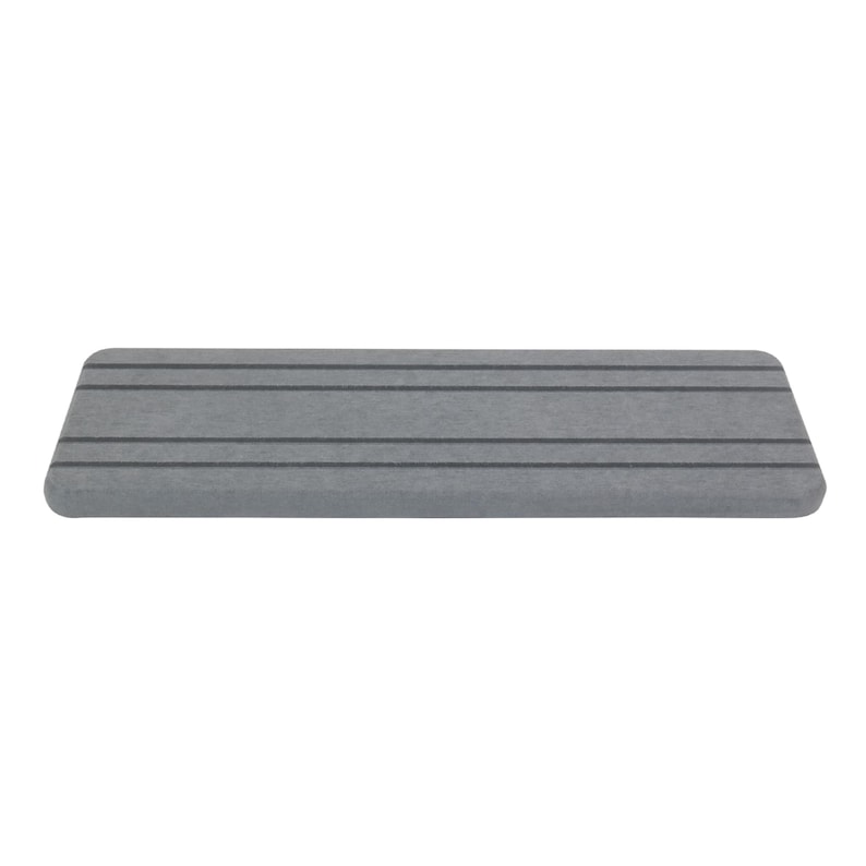 May include: A rectangular, gray, foam step with four dark gray horizontal stripes. The step has rounded edges and is designed for use in a bathroom or shower. The step is made of a durable, non-slip material.