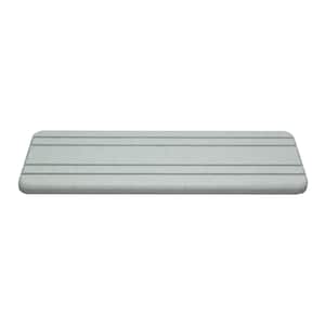 May include: A rectangular, light gray shelf with rounded edges. The shelf has several evenly spaced, dark gray horizontal lines across its surface. The shelf is designed to be mounted on a wall or used as a display surface.