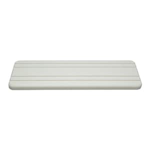 May include: A rectangular, off-white shelf with rounded corners. The shelf has several parallel, light-colored lines running horizontally across its surface. The design is simple and minimalist, suitable for various home decor styles.