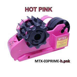 May include: A pink tape dispenser with a black tape cutter and a clear tape roll. The dispenser has a black handle and a label that says "M'TEX Tape Cutter Prime". The dispenser is labeled "MTX-03PRIME-h.pnk" and "HOT PINK".