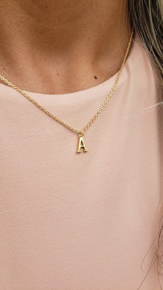 Tiny gold on sale initial pendant