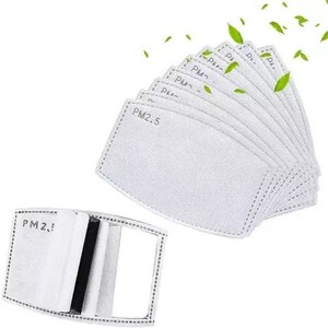 May include: A collection of white PM2.5 filter replacements for face masks. The filters are rectangular with rounded corners and feature the text "PM2.5". One filter is shown open, revealing layers of filtration material.