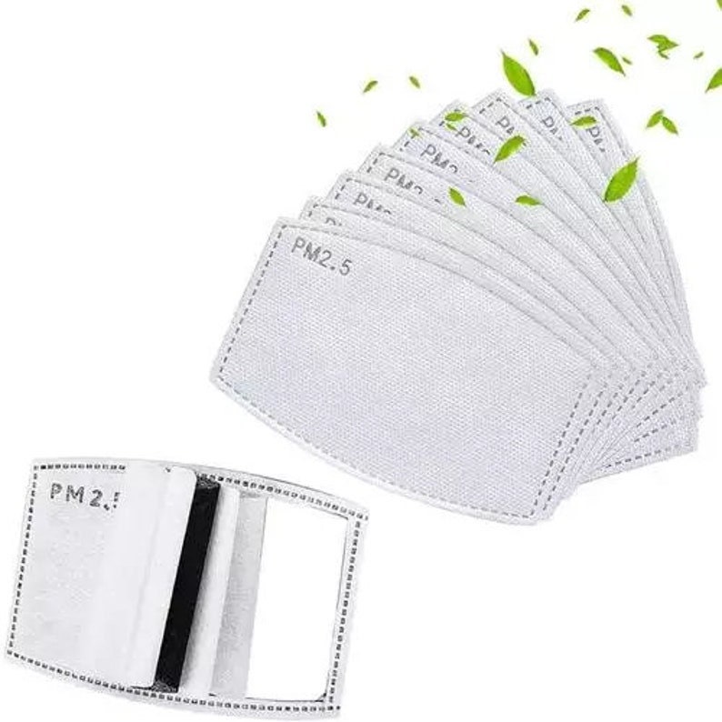 May include: A collection of white PM2.5 filter replacements for face masks. The filters are rectangular with rounded corners and feature the text "PM2.5". One filter is shown open, revealing layers of filtration material.