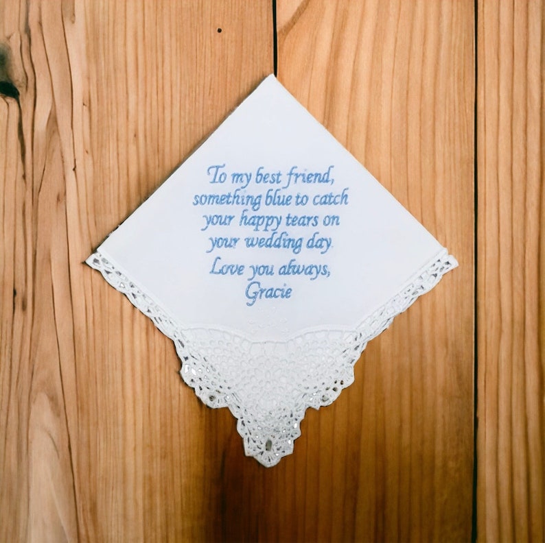 Our customizable white Something New, Something Blue handkerchief on a brown wood background.