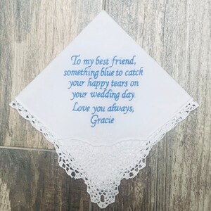 Our customizable white Something New,  Something Blue handkerchief on a gray wood background.