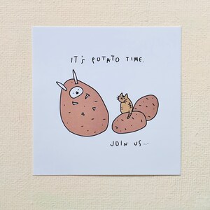 May include: A white card with a brown potato character wearing a white costume with horns and a cat character standing on a potato. The text on the card reads "It's potato time. Join us..."