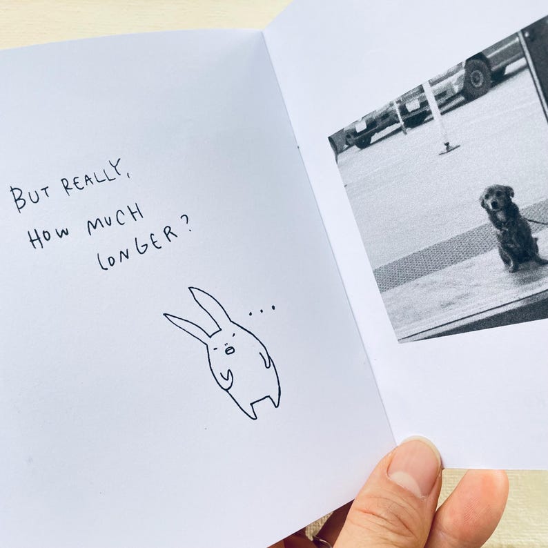 May include: A black and white illustration of a rabbit with a thought bubble above its head. The text "But really, how much longer?" is written in black ink on a white background.