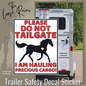 May include: A white trailer with a red and black decal that reads "Please Do Not Tailgate I Am Hauling Precious Cargo!" with a black silhouette of a horse with a red heart on its side.