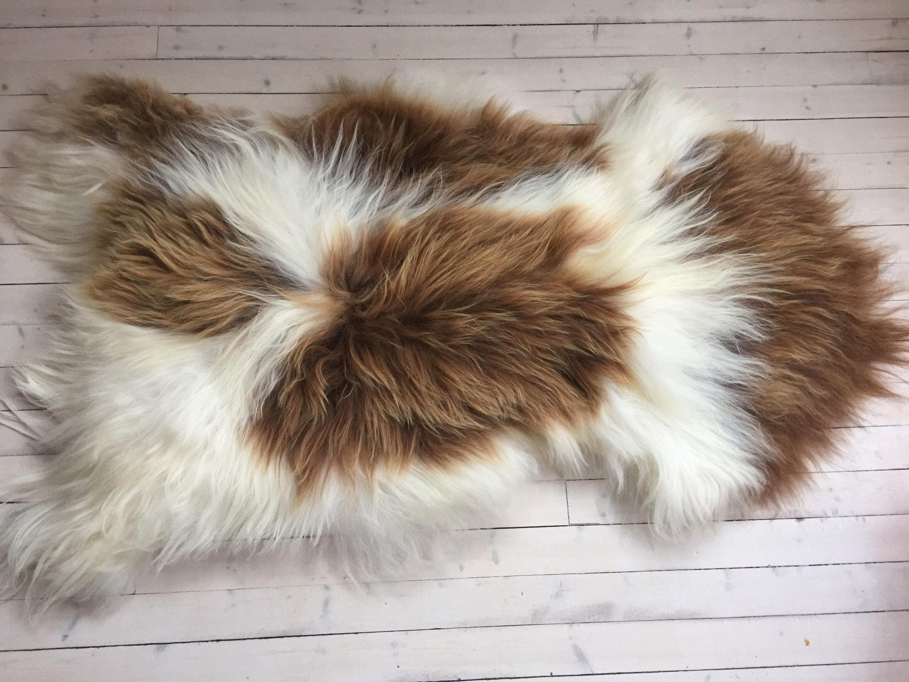 Spotted, long haired, large sheepskin rug spael sheep throw Brown