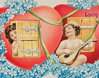 Embossed Valentine Postcard Cupids Singing in Heart House Surrounded with Flowers Printed in Germany