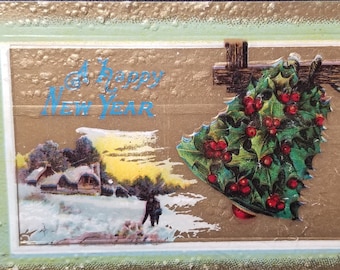 Christmas Postcard Holly Covered Bell with People Ice Skating House in Distance Raised Finish