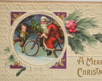 Christmas Postcard Embossed Santa on Bicycle with Child