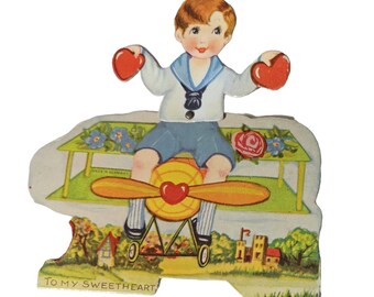 Vintage Die Cut Mechanical Valentine Card Boy Riding Airplane Holding Hearts Made in Germany