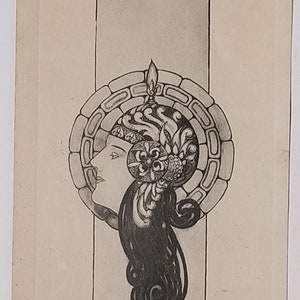 May include: A black and white line drawing of a woman's head with intricate hair and a crown-like headdress. The drawing is framed by a circle of stones.