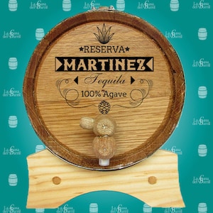 May include: A wooden barrel with a metal band and a wooden tap. The barrel is labelled "RESERVA MARTINEZ Tequila 100% Agave".