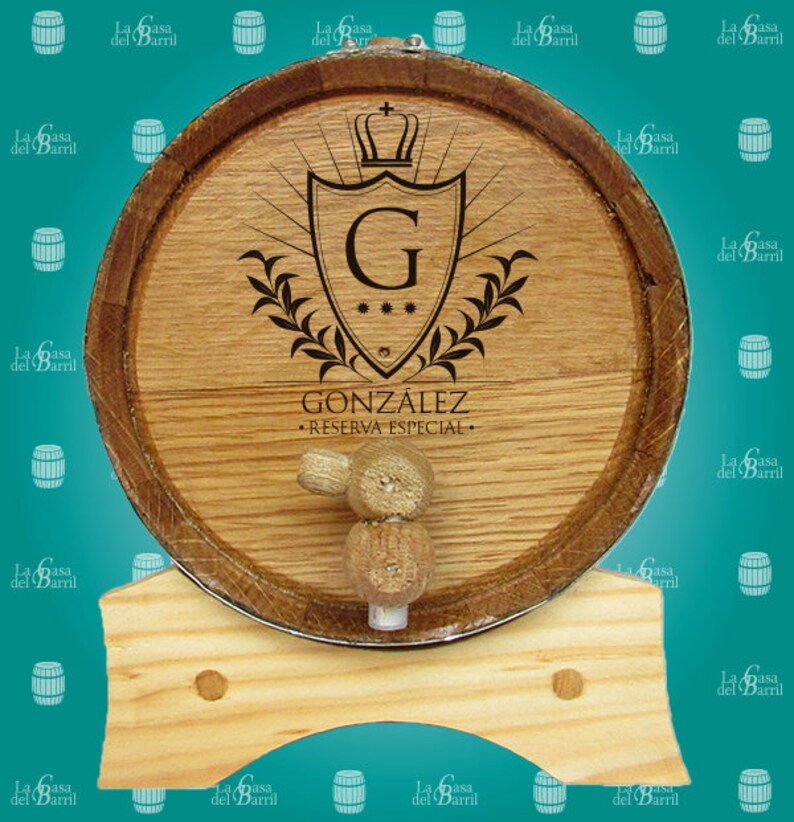 May include: A wooden barrel with a metal band and a wooden stand. The barrel is decorated with a shield featuring a letter G and a crown. The text "GONZ&Aacute;LEZ - RESERVA ESPECIAL -" is printed on the barrel.