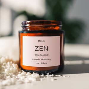 May include: A brown glass jar candle with a white label that reads "Bélier ZEN SOY CANDLE Lavender + Rosemary 4oz | 113 grs".