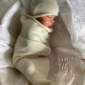 Baby cocoon and matching hat, hand knitted in the softest Falklands Merino wool and silk. Cream, gender neutral and a perfect new baby gift.