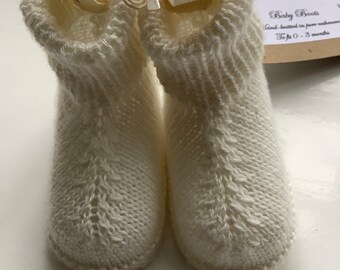 Soft pure cashmere baby boots, hand knitted in fine, super-lightweight white natural yarn. Made in UK, beautifully packaged.