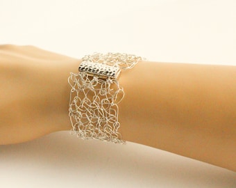 Pure silver hand-woven wire cuff bracelet with silver clasp.