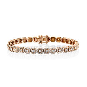 This unique diamond tennis bracelet features stunning pave set diamond clusters on cushion shape links that sparkle and shine with every movement.