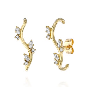 These unique 14K natural diamond earrings are the perfect modern leaves gold earrings. beautiful for a wedding or any occasion.