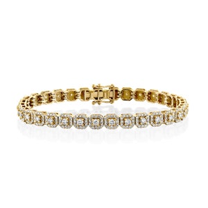 This unique diamond tennis bracelet features stunning pave set diamond clusters on cushion shape links that sparkle and shine with every movement.