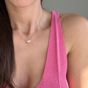 This is a dainty and elegant 14K solid gold lab diamond necklace, set with sparkling pear cut diamonds in an elegant pendant, the perfect diamond anniversary necklace.