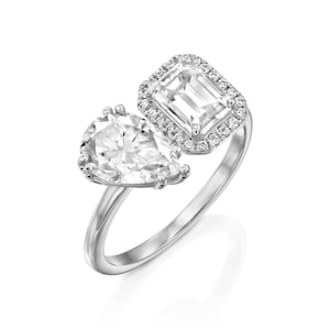 This is a stunning double-stone engagement ring, the perfect two-stone diamond ring, set with pear and emerald cut moissanite, surrounded by a halo of white diamonds, a unique toi et moi engagement ring.