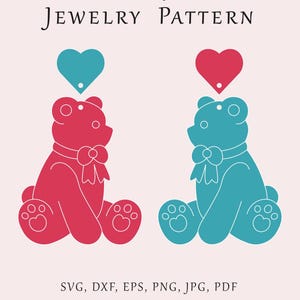 May include: Two teddy bear jewelry patterns, one pink and one blue, with a heart cutout at the top.  The patterns are ready to be cut out and used for crafting.