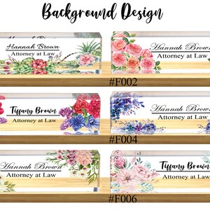May include: Six different floral designs for a personalized acrylic desk nameplate. Each design features a different floral arrangement with watercolor-style flowers and greenery. The nameplates are labeled with the numbers #F001 through #F006.