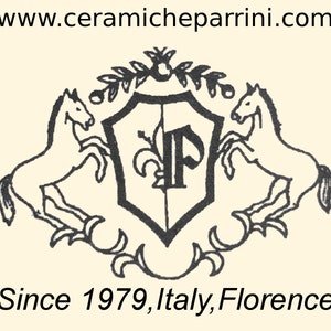 May include: Cream-colored emblem with a black shield, two rearing horses, and the text "www.ceramicheparrini.com". The shield features a stylized "P" and floral elements. Text at the bottom reads "Since 1979, Italy, Florence".