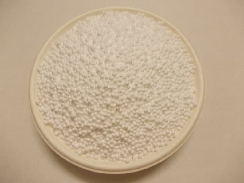 May include: A white bowl filled with small white polystyrene packing peanuts.