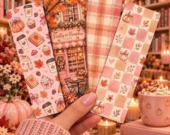May include: Four rectangular bookmarks featuring autumn-themed designs. One displays a cafe with the text Pretty in Pumpkin café, another has a pink plaid pattern, and two feature repeating motifs of pumpkins, coffee cups, sweaters, and leaves.