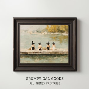 May include: A framed print featuring a vintage-style painting of four figures in witch hats sitting on a dock by a lake. The figures are wearing swimsuits. The frame is dark brown. The text "GRUMPY GAL GOODS ALL THINGS PRINTABLE" is at the bottom.