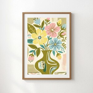 Peut inclure: Une impression d'art encadr&eacute;e repr&eacute;sentant un arrangement floral color&eacute; dans un vase vert. Les fleurs sont dans des tons de jaune, rose et bleu, avec des feuilles vertes. Le vase a un design unique. L'&oelig;uvre est sur un fond neutre.