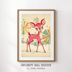 Può includere: Una stampa artistica da parete incorniciata raffigurante un cervo rosa stilizzato in un paesaggio innevato con forme a stella astratte nei toni del giallo, verde acqua e arancione. Il testo GRUMPY GAL GOODS ALL THINGS PRINTABLE è stampato sotto la cornice.