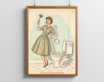 May include: A framed print with a retro illustration of a woman in a floral dress holding a plunger near a toilet. The print includes the text "I will plunge your face." and "GRUMPY GAL GOODS ALL THINGS PRINTABLE."
