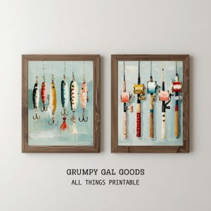 May include: Two framed prints depicting fishing lures and rods. The left print shows colourful lures with hooks, while the right print displays fishing rods with reels. The artwork has a rustic, vintage aesthetic with a light blue background and wooden frames.