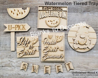 May include: Unfinished wooden tiered tray kit with watermelon and summer-themed cutouts. Includes a watermelon slice, sign that says "U-PICK", a sign that says "Farm Fresh Watermelon", a sign that says "Life is Sweet", a sign that says "Hello Sweet Summer", a gnome, and a banner that says "SWEET".