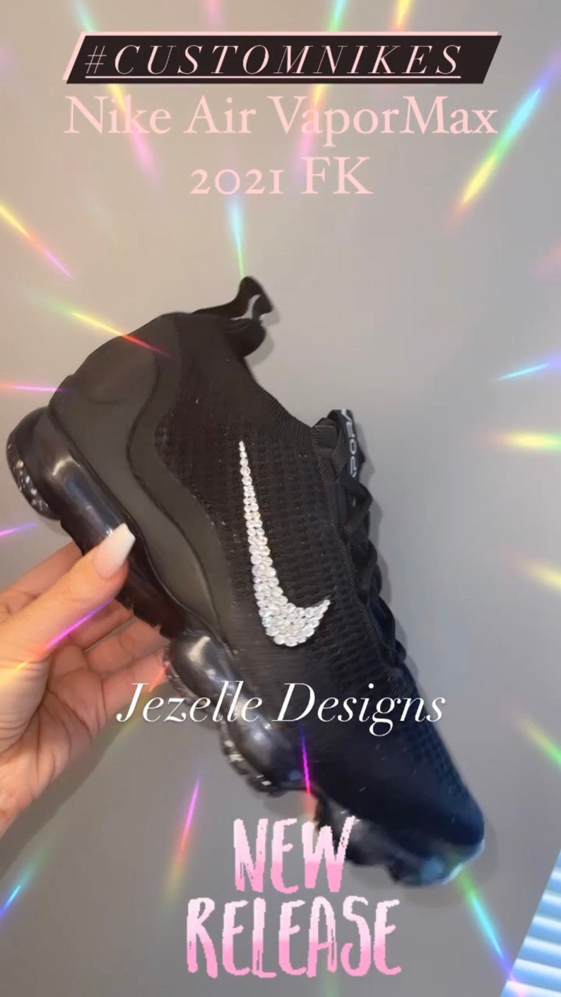 May include: Black Nike Air VaporMax 2021 FK trainers with a sparkly diamond-encrusted swoosh logo. The shoes are new and have the text "Jezelle Designs" and "NEW RELEASE" on them. #CUSTOMNIKES
