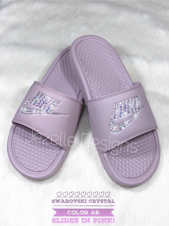 pink and purple nike slides