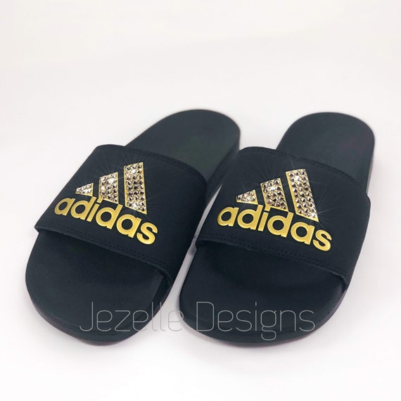 black and gold adidas slides